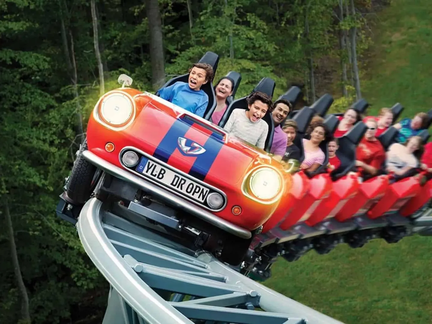 Family riding a themed coaster